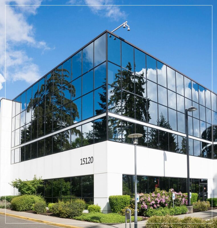 Commerical Office Property white building with reflective glass windows